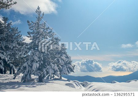 Pristine winter mountain views reveal snow-covered peaks and untouched alpine landscapes in the Sierra Nevada, Spain. 136295571