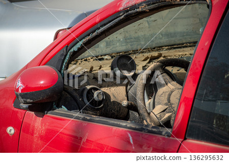 Damaged cars and debris from flooding caused by floods from hurricane DANA in Valencia, Spain  136295632