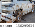 Damaged cars and debris from flooding caused by floods from hurricane DANA in Valencia, Spain  136295634