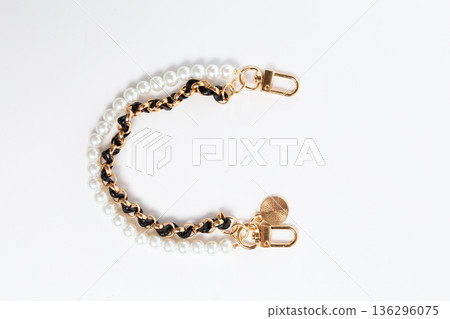 Top view of double decorative handbag chain with pearls and black braid Top view of double decorative handbag chain with pearls and black braid 136296075