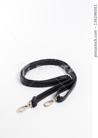 Top view of black nylon bag strap with two gold-tone carabiners Top view of black nylon bag strap with two gold-tone carabiners 136296081