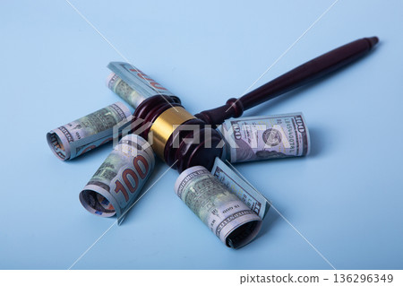 Gavel and money representing legal corruption and crime 136296349