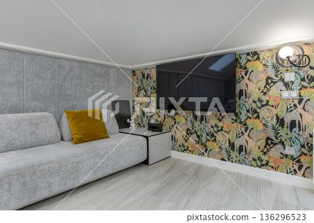 Modern Attic Living Room with Sofa and Wall-Mounted TV 136296523