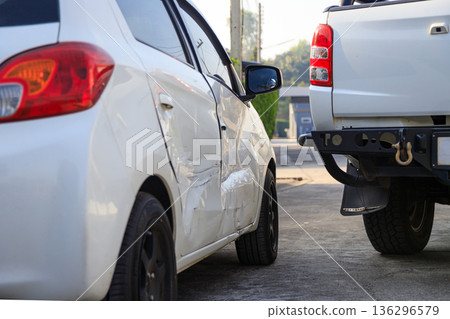 Car accident damage after collision on urban road Car accident damage after collision on urban road 136296579