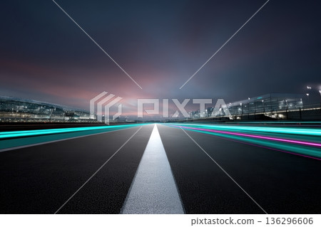 Futuristic racetrack at night with neon lights showing speed and technology in a cityscape 136296606