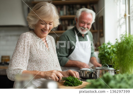 Senior couple cooking fresh herbs in kitchen 136297399