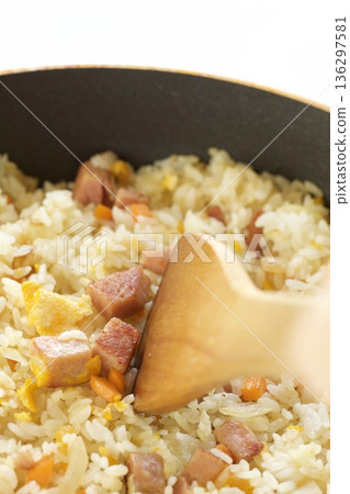 Fried rice made with luncheon meat, carrots, and onions 136297581