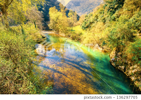 Mountain landscape with mountain river in early spring. Beautiful nature. Wilderness Mountain landscape with mountain river in early spring. Beautiful nature. Wilderness 136297705
