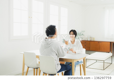 A couple drinking coffee A couple drinking coffee 136297759