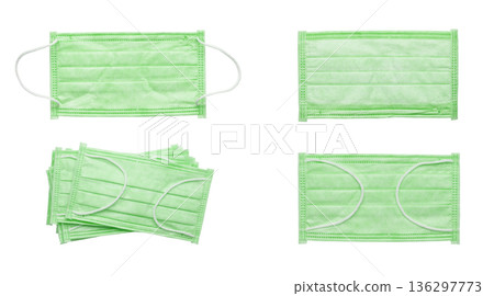 Surgical mask with rubber ear straps on a white background. Surgical mask with rubber ear straps on a white background. 136297773