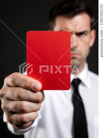 Man shows bright red card with stern expression - ai generated 136298220