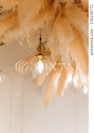 Glass globe pendant light under pampas ceiling decor, warm minimal interior Glass globe pendant light under pampas ceiling decor, warm minimal interior 136298771