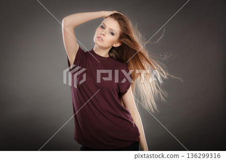 Glamorous stunning woman with waving hair. Glamorous stunning woman with waving hair. 136299316