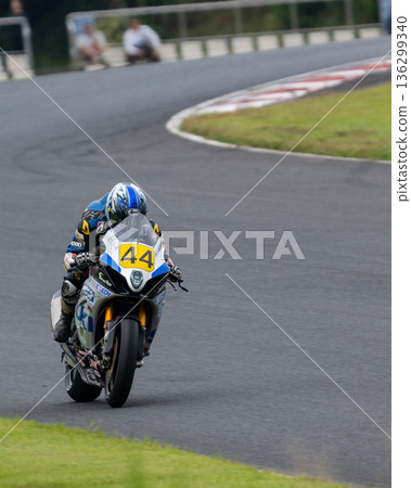 Racing bike running on the circuit 136299340