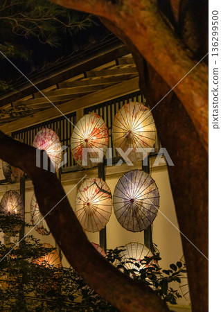 Illuminated Japanese umbrellas at night at Yushien Garden on Daikon Island in Yatsuka Town, Matsue City, Shimane Prefecture, Japan Illuminated Japanese umbrellas at night at Yushien Garden on Daikon Island in Yatsuka Town, Matsue City, Shimane Prefecture, Japan 136299500