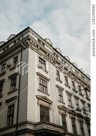 Corner view of an old residential building in Belgrade old town, showing classical European architecture, symmetrical windows and elegant facade details 136299880