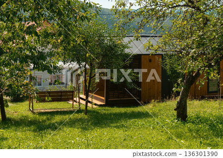 Modern Wooden Cabin in Green Garden Modern Wooden Cabin in Green Garden 136301390