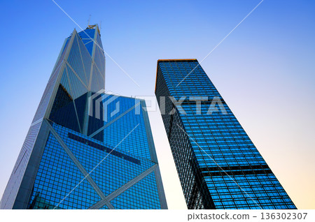Skyscraper Business tower. Glass facade office buildings. High-rise bank building in Hong Kong Skyscraper Business tower. Glass facade office buildings. High-rise bank building in Hong Kong 136302307
