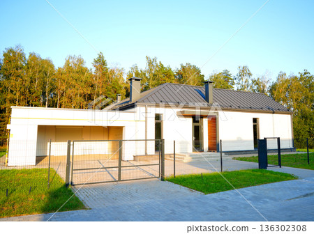 Suburban residential neighborhood, home, fence of single family home. Suburb family house. 136302308