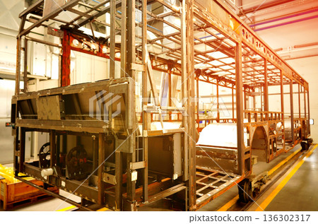 Bus assembly factory. Industrial production workshop, passenger transport assembly. Bus assembly factory. Industrial production workshop, passenger transport assembly. 136302317