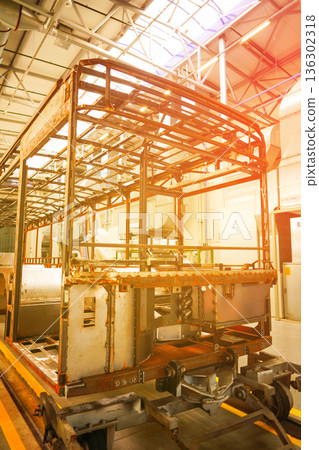 Bus assembly factory. Industrial production workshop, passenger transport assembly.  136302318