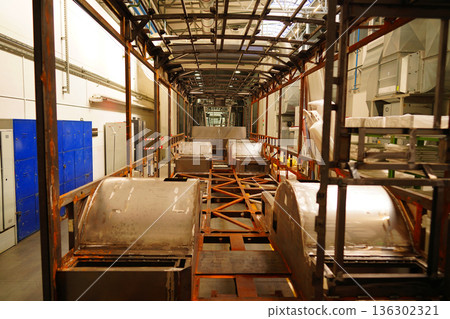 Bus assembly factory. Industrial production workshop, passenger transport assembly. Bus assembly factory. Industrial production workshop, passenger transport assembly. 136302321