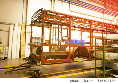 Bus assembly factory. Industrial production workshop, passenger transport assembly. Bus assembly factory. Industrial production workshop, passenger transport assembly. 136302322