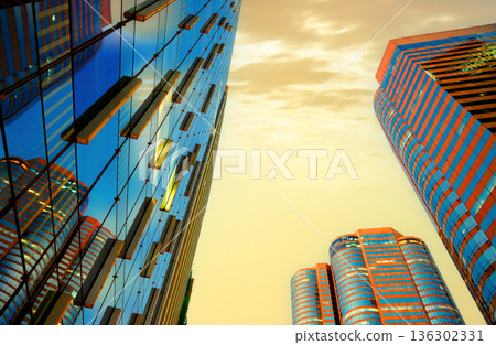 High-rise bank building Hong Kong Central Business District. Glass facade hotel skyscraper building High-rise bank building Hong Kong Central Business District. Glass facade hotel skyscraper building 136302331
