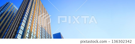 Skyscrapers towers building on banner background with space for text. Skyscrapers towers building on banner background with space for text. 136302342