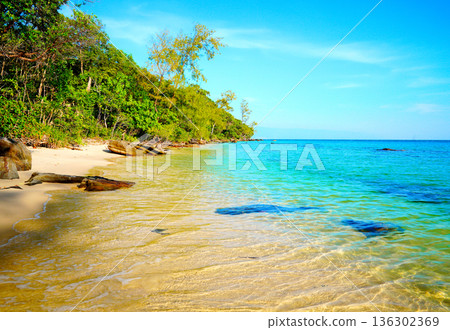 Coast clear sea water, rocks in tropical island. Wild rocky shore at jungle Cambodia. Clear water 136302369