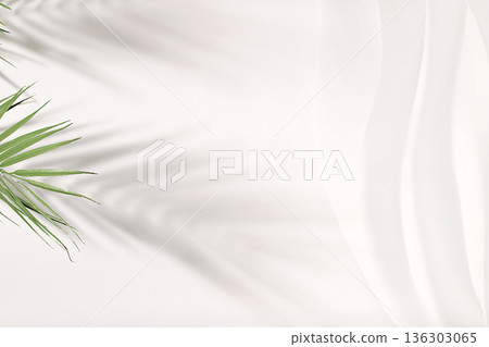 Premium empty podium with shadows of tropical palm leaves on sunny wall, minimal abstract background for cosmetics product presentation, design template, podium on pedestal, selective focus. 136303065