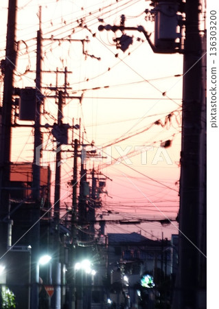 A sunset scene of tangled electric wires near Higashi Hanazono in Higashi Osaka City 136303200