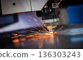 CNC Laser cutting of metal, modern industrial technology. 136303243