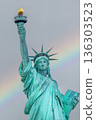 Statue of Liberty closeup with rainbow sky in the background. 136303523