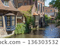 Old brick houses on the river bank in Old Town of Bruges.  Belgium. 136303532