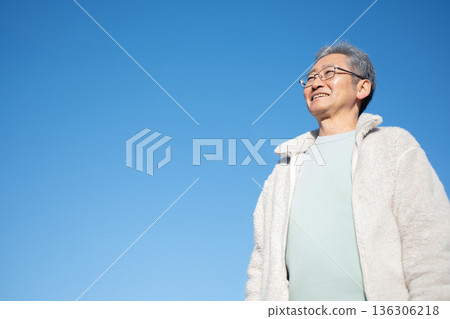 Senior man standing against the blue sky 136306218
