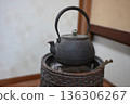 Iron kettle in the hearth 136306267