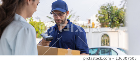 Delivery express courier young man use giving boxes or Food to woman customer  at front home.  136307503