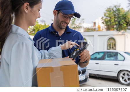 Delivery express courier young man use giving boxes or Food to woman customer at front home. Delivery express courier young man use giving boxes or Food to woman customer at front home. 136307507