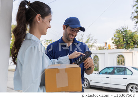 Delivery express courier young man use giving boxes or Food to woman customer at front home. Delivery express courier young man use giving boxes or Food to woman customer at front home. 136307508