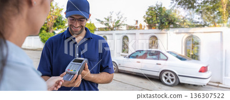 Delivery express courier young man use giving boxes or Food to woman customer  at front home.  136307522