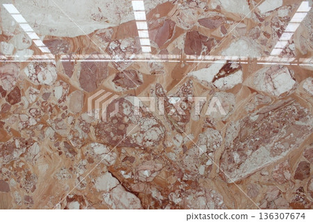 Breccia Oniciata pink marble texture with beige and white fragments. This Italian marble features a warm breccia pattern for classic interior design. 136307674