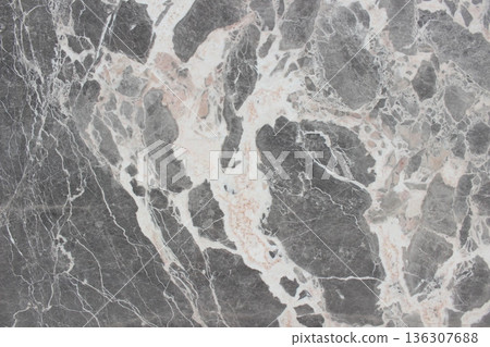 Breccia Grigio marble texture featuring grey rock fragments and thick, dynamic creamy white veins. Breccia Grigio marble texture featuring grey rock fragments and thick, dynamic creamy white veins. 136307688