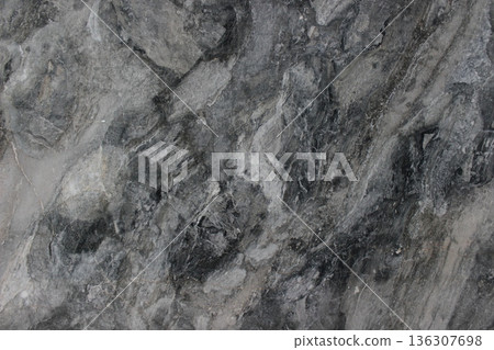Grigio Carnico marble texture from Italy with a dramatic natural blend of dark gray tones and white patches. 136307698