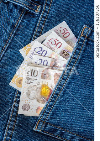 Jeans with british pound money. United Kindom bills in the pants pocket for commerce concept. 136307856