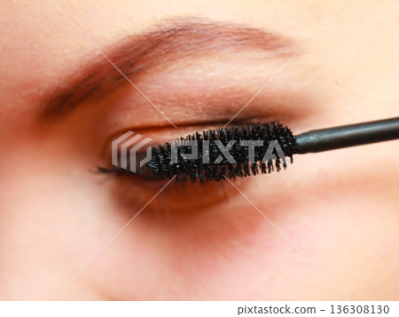 Close up woman getting make up, mascara 136308130