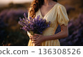 woman holding lavender bouquet in field 136308526