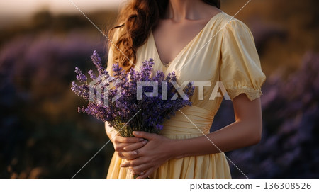 woman holding lavender bouquet in field 136308526
