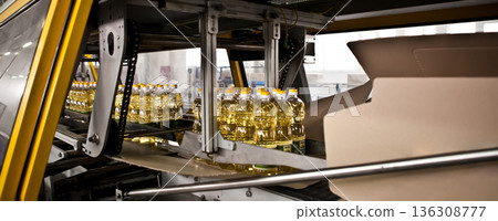 Automated packaging line for sunflower oil in a modern factory Automated packaging line for sunflower oil in a modern factory 136308777