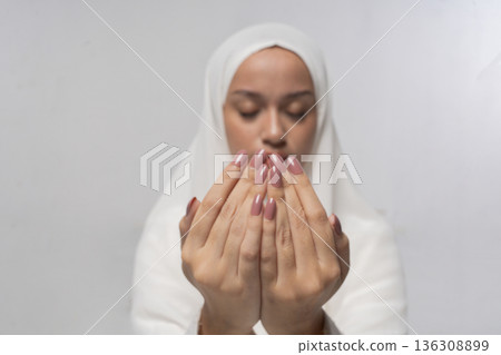Relaxed individual in peaceful meditation setting with textured rug Relaxed individual in peaceful meditation setting with textured rug 136308899